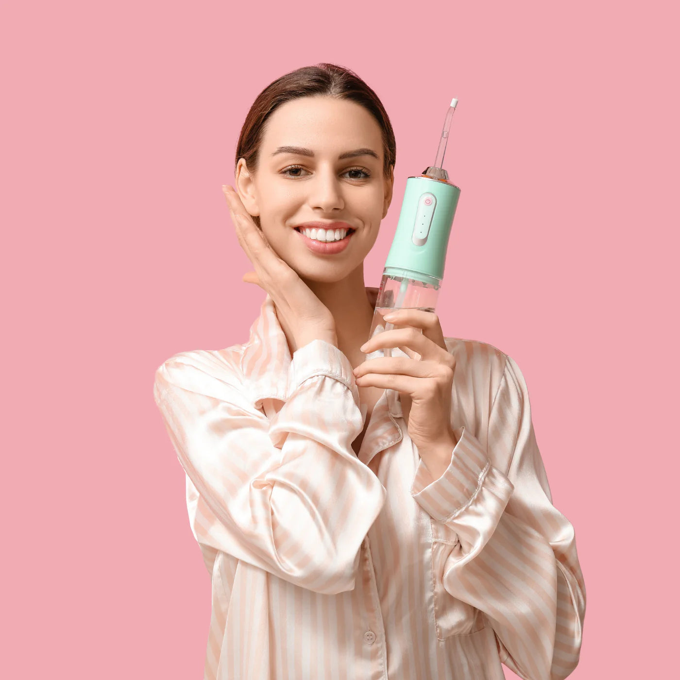 Woman holding the best Portable Water Flosser – Cordless Oral Irrigator for Daily Dental Hygiene and Fresh Breath